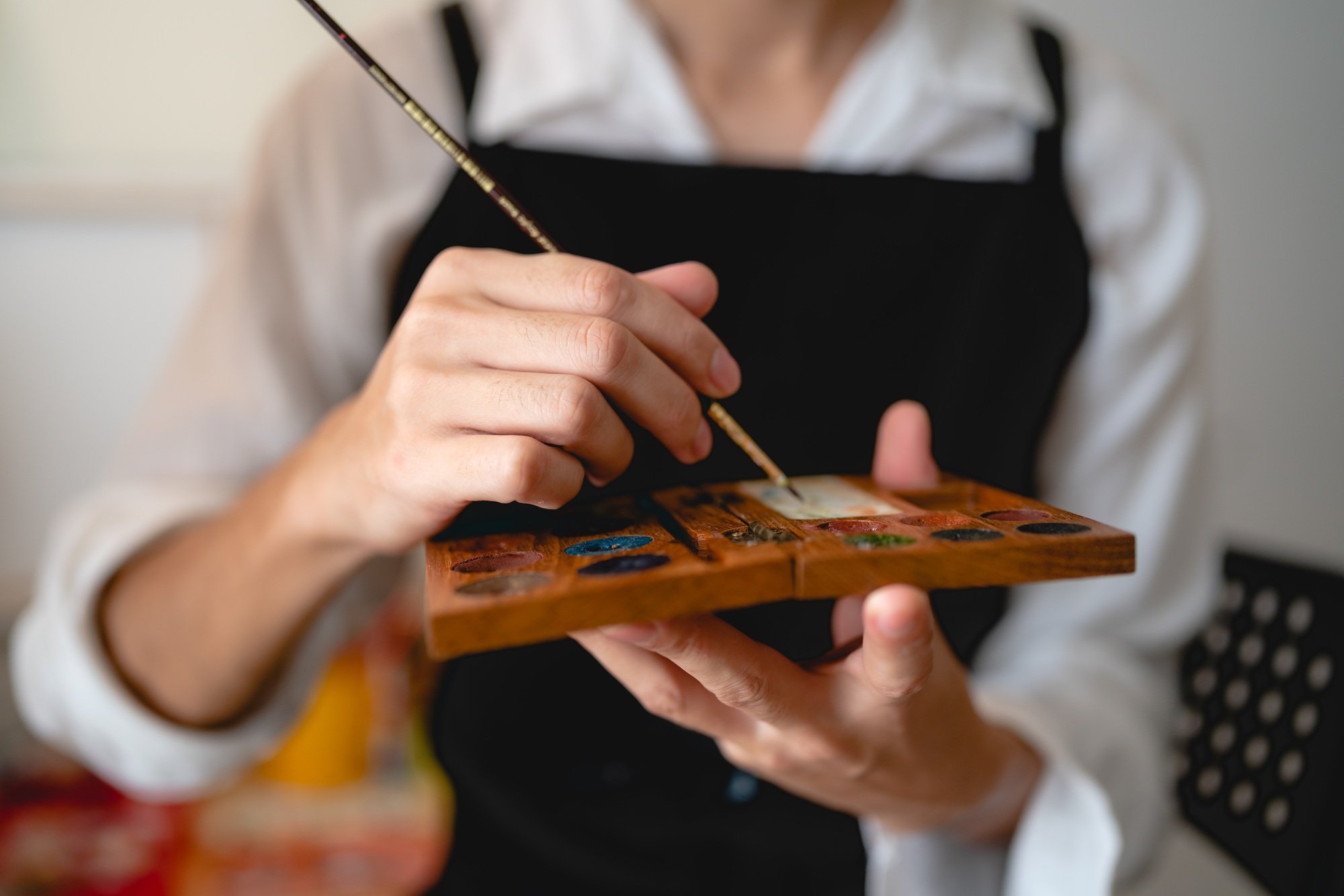 creative artist working on colours art drawing picture with brush paint, watercolor paintbrush