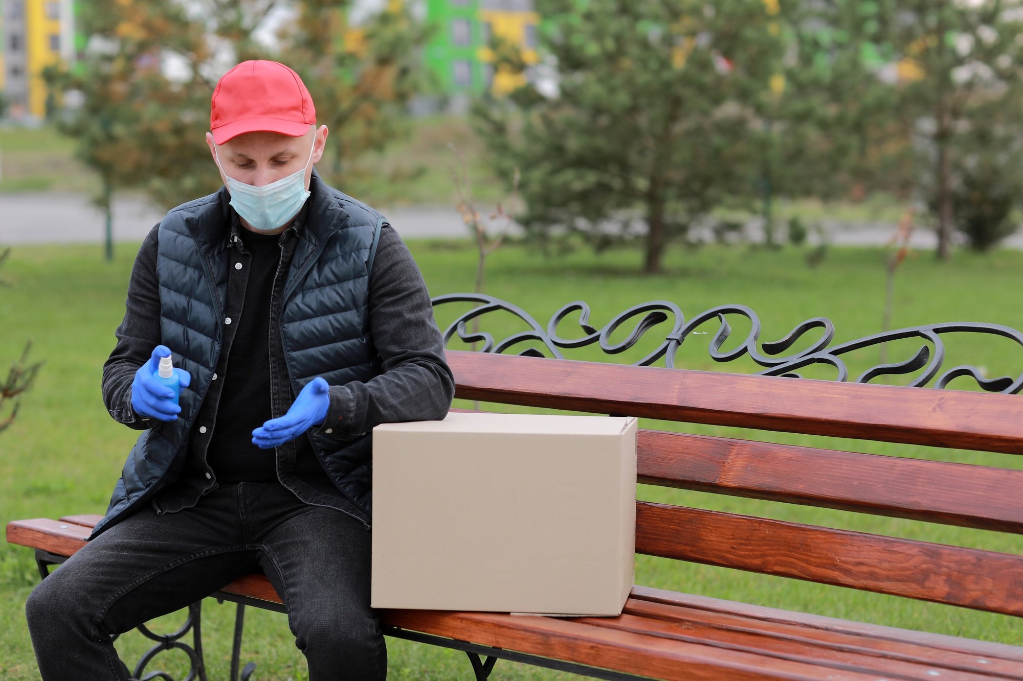 Delivery service courier during the Coronavirus, COVID-19, pandemic, delivery man in medical