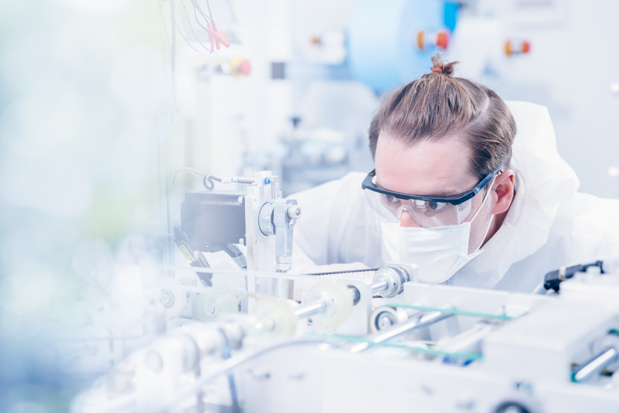 Engineering scientist working with advanced technology medical device in science laboratory