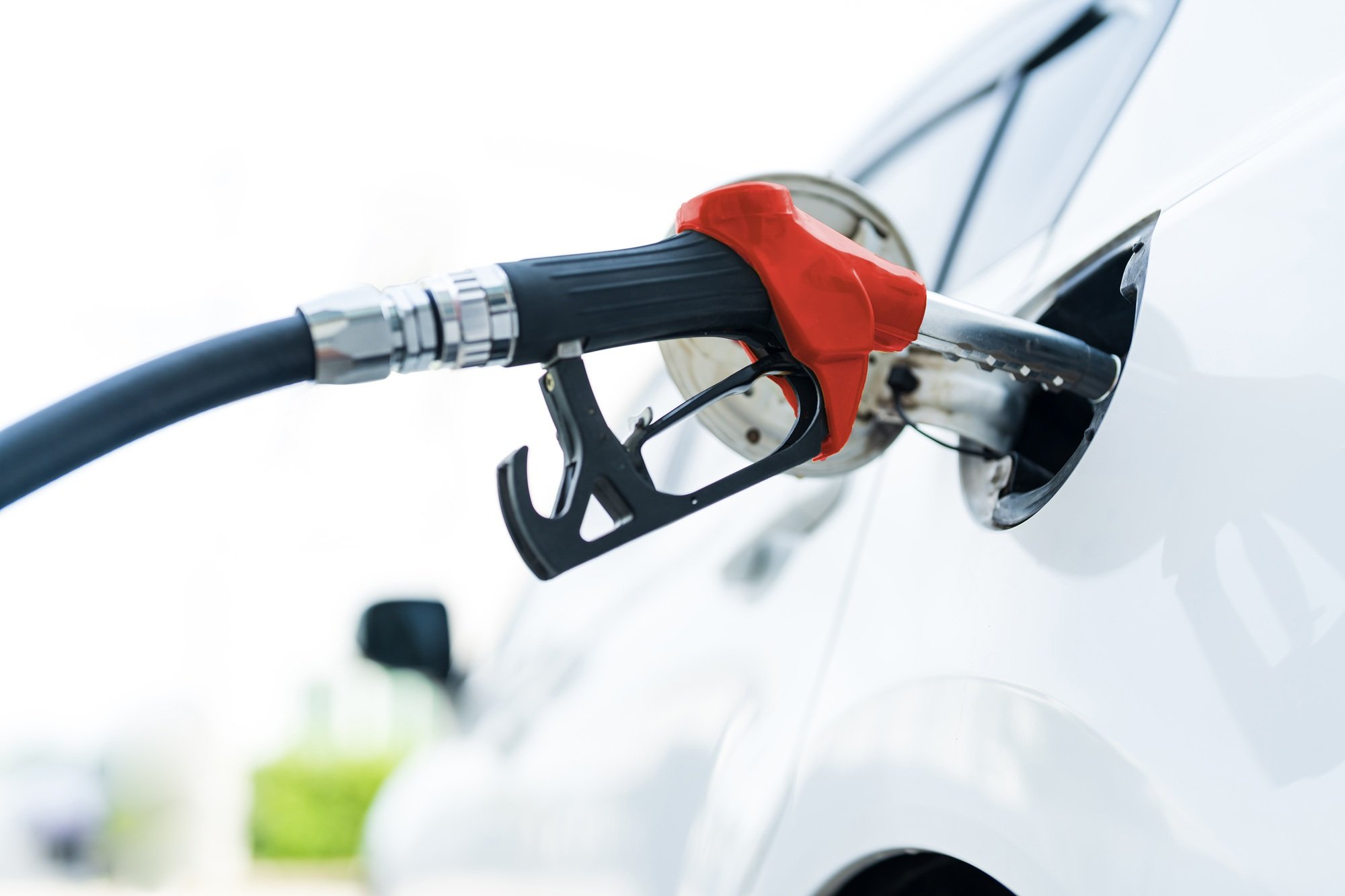 Filling car with gas fuel at station pump