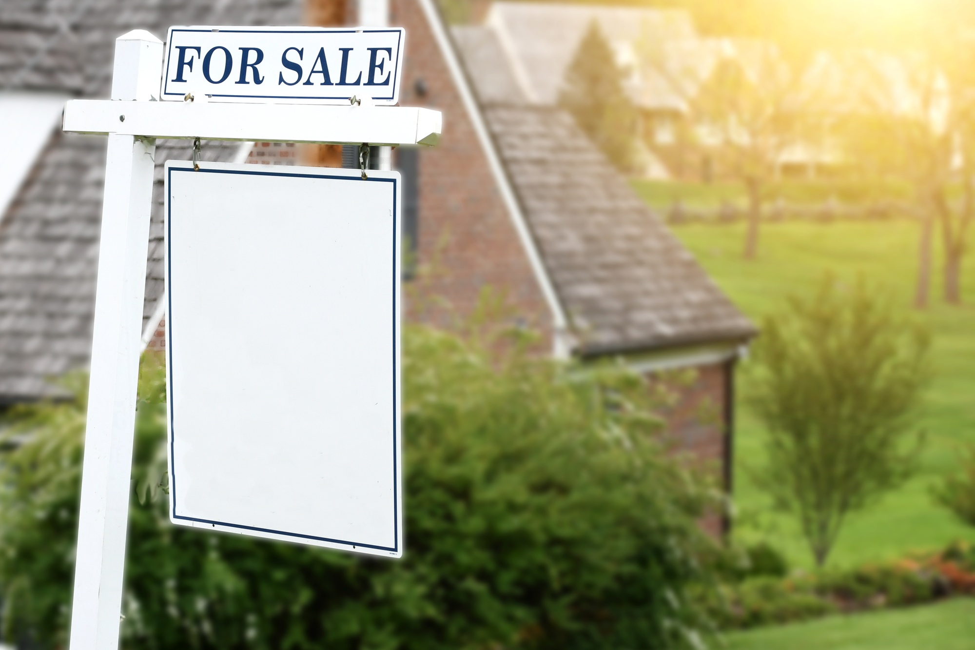 For Sale sign in front of home suitable for mock up. Real estate housing market - add your design