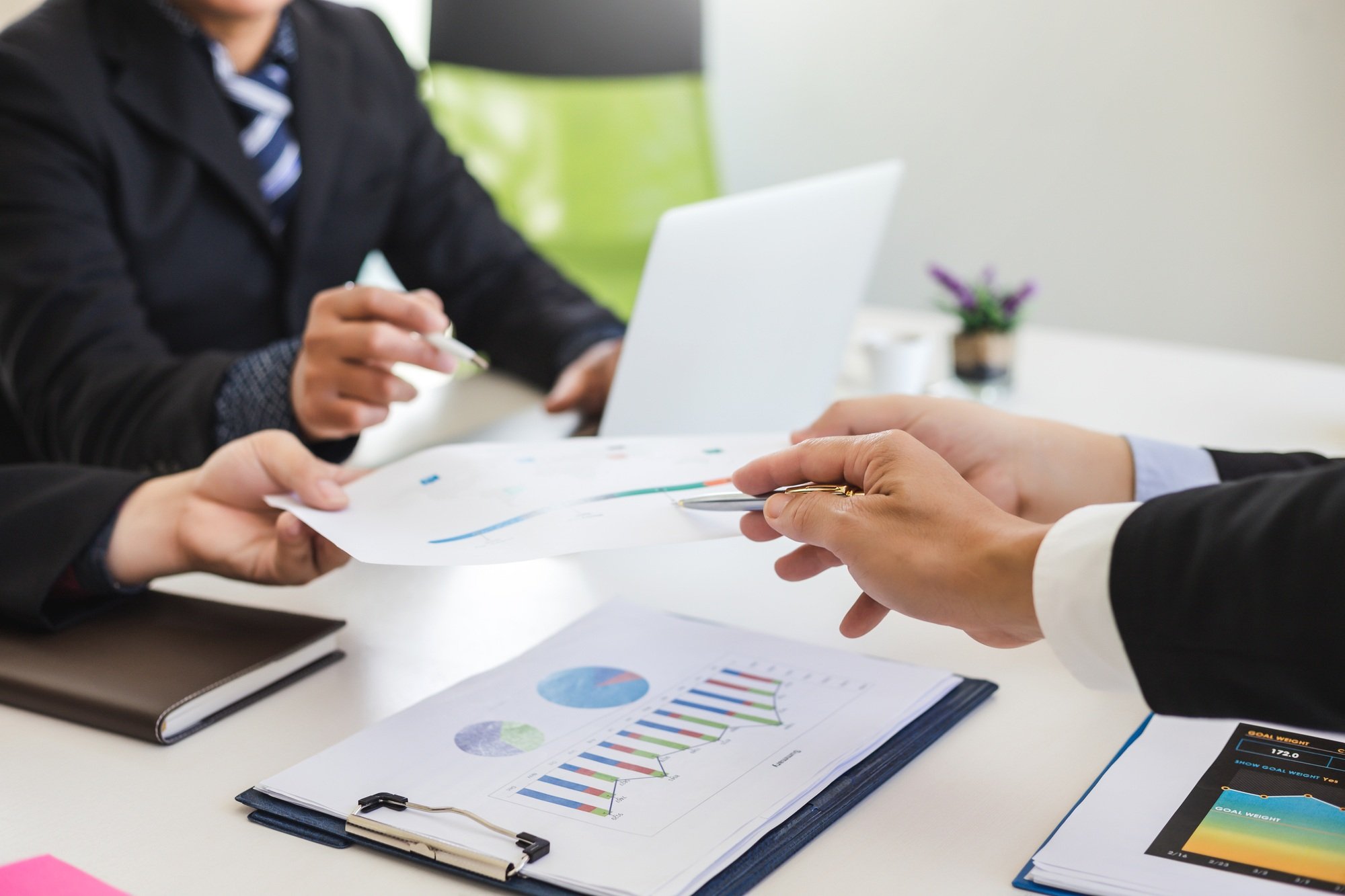 Group of business people at meeting assessment the state of business investment and marketing.