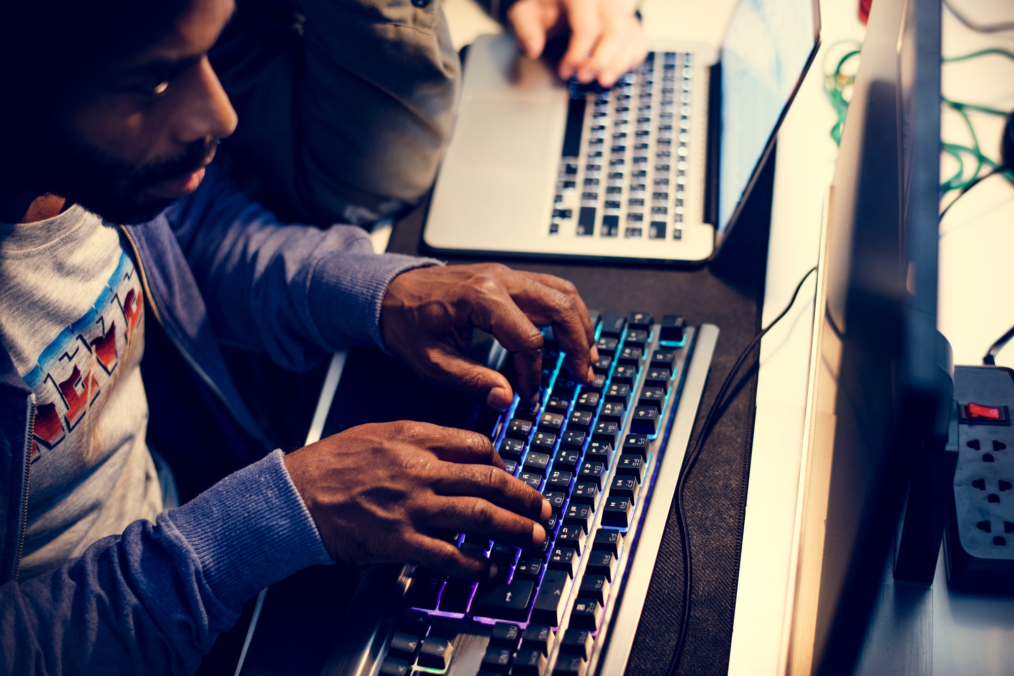 Hacker using keyboard typing phishing on the internet