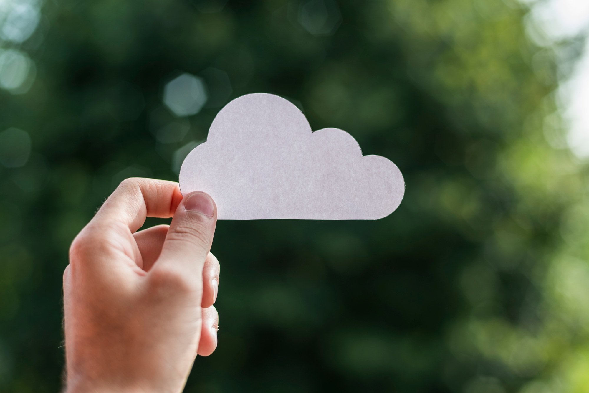 Hand holding cloud computing symbol