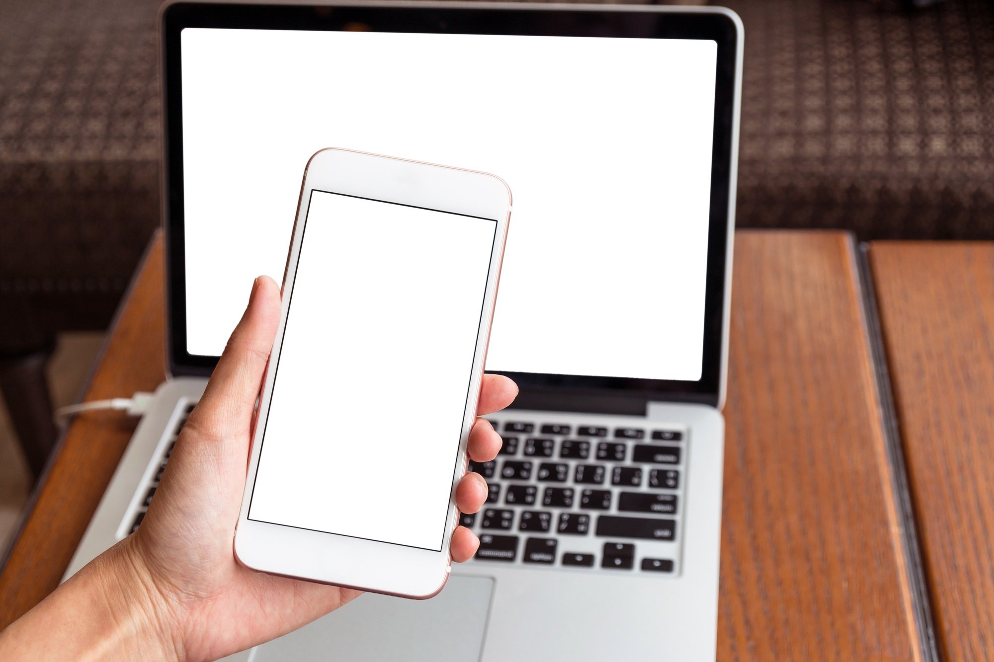 Hand holding the technology smart mobile phone shown white background for product mockup
