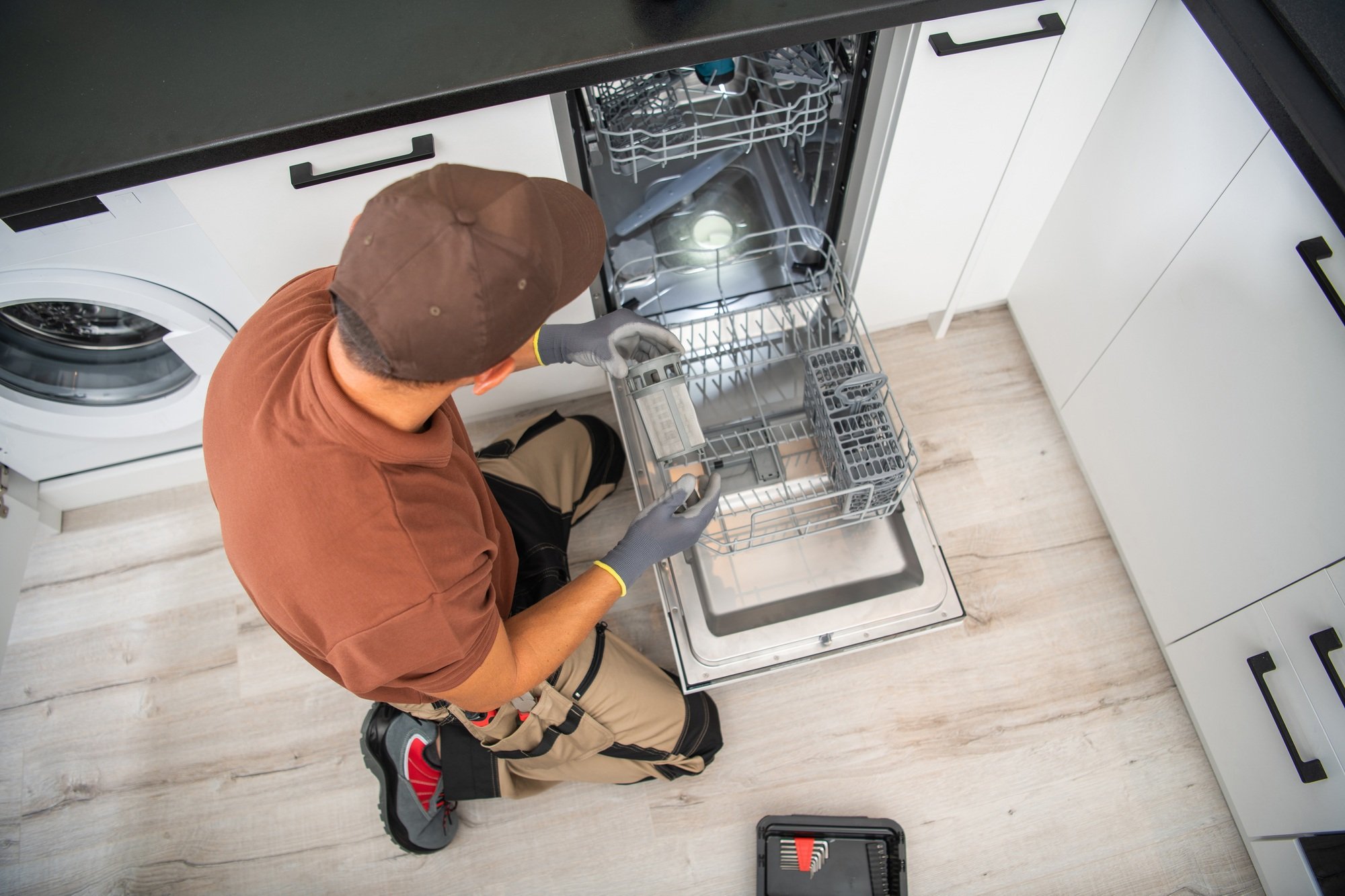Handyman Assembling the Dishwasher