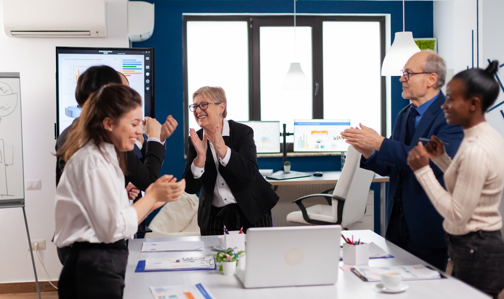 Happy diverse colleagues with new business opportunity