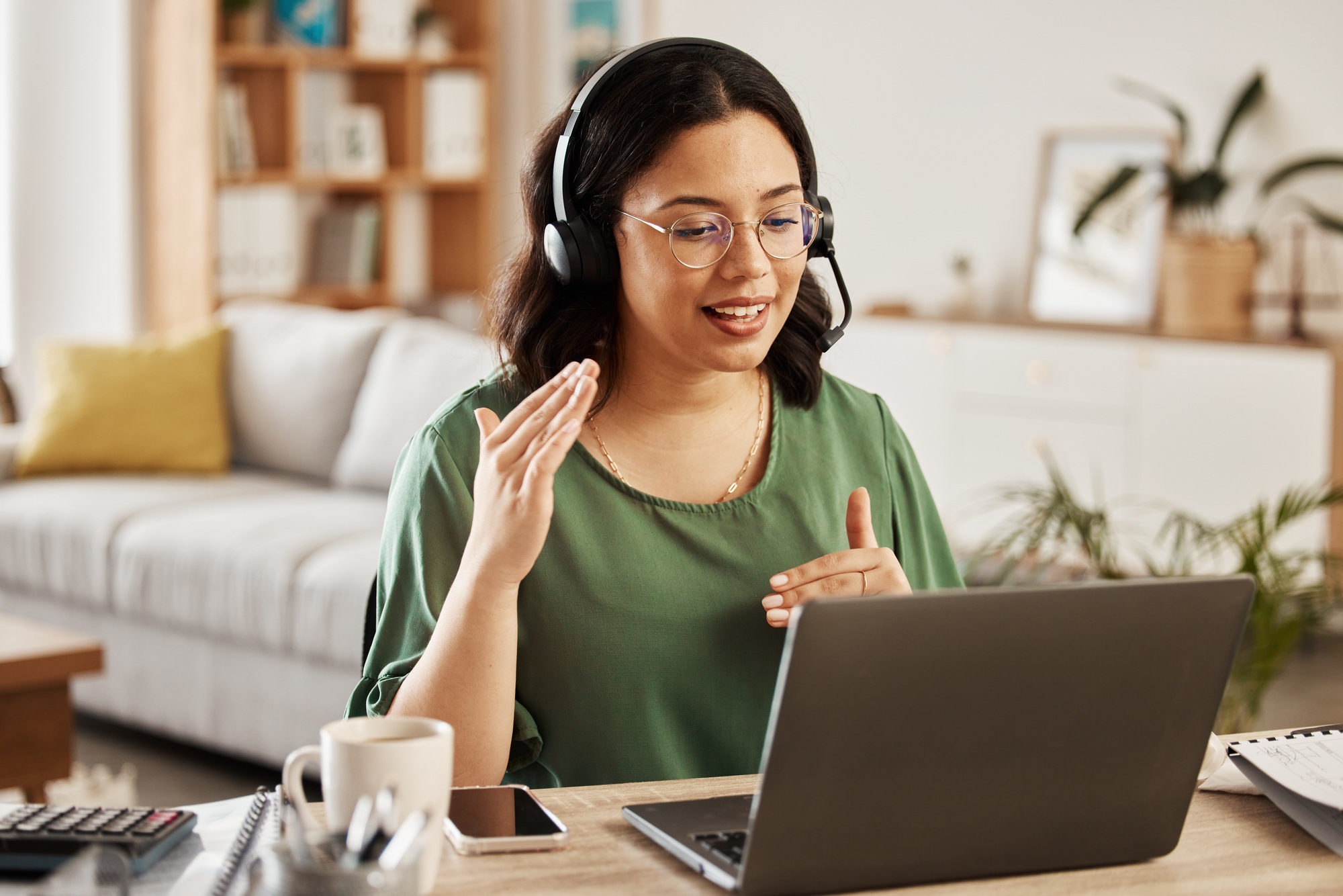 Home customer support, laptop video call and woman explain consultation, ecommerce or sales pitch i