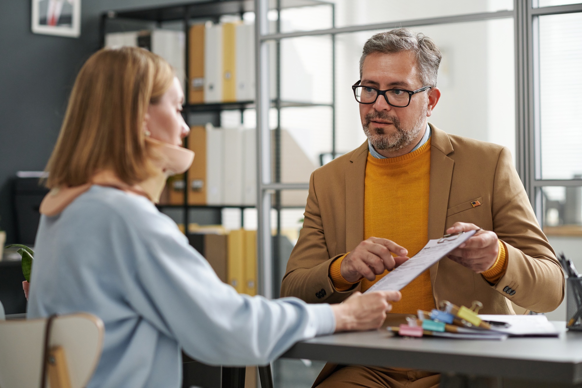 Insurance agent talking to client at meeting