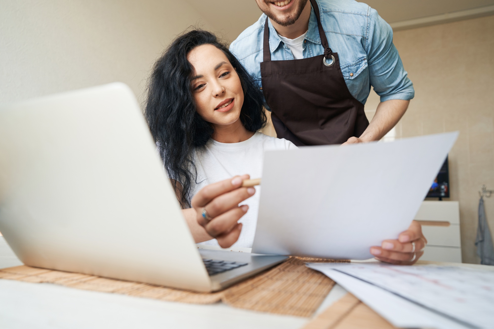 Joyous lady demonstrating documentation to business companion