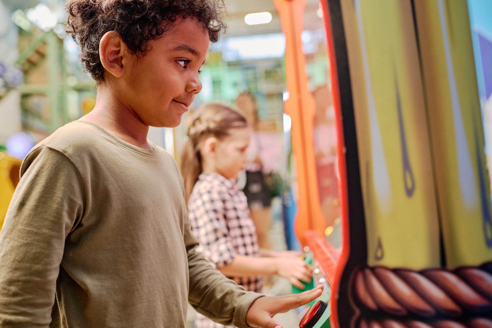 Little boy in front of vending machine