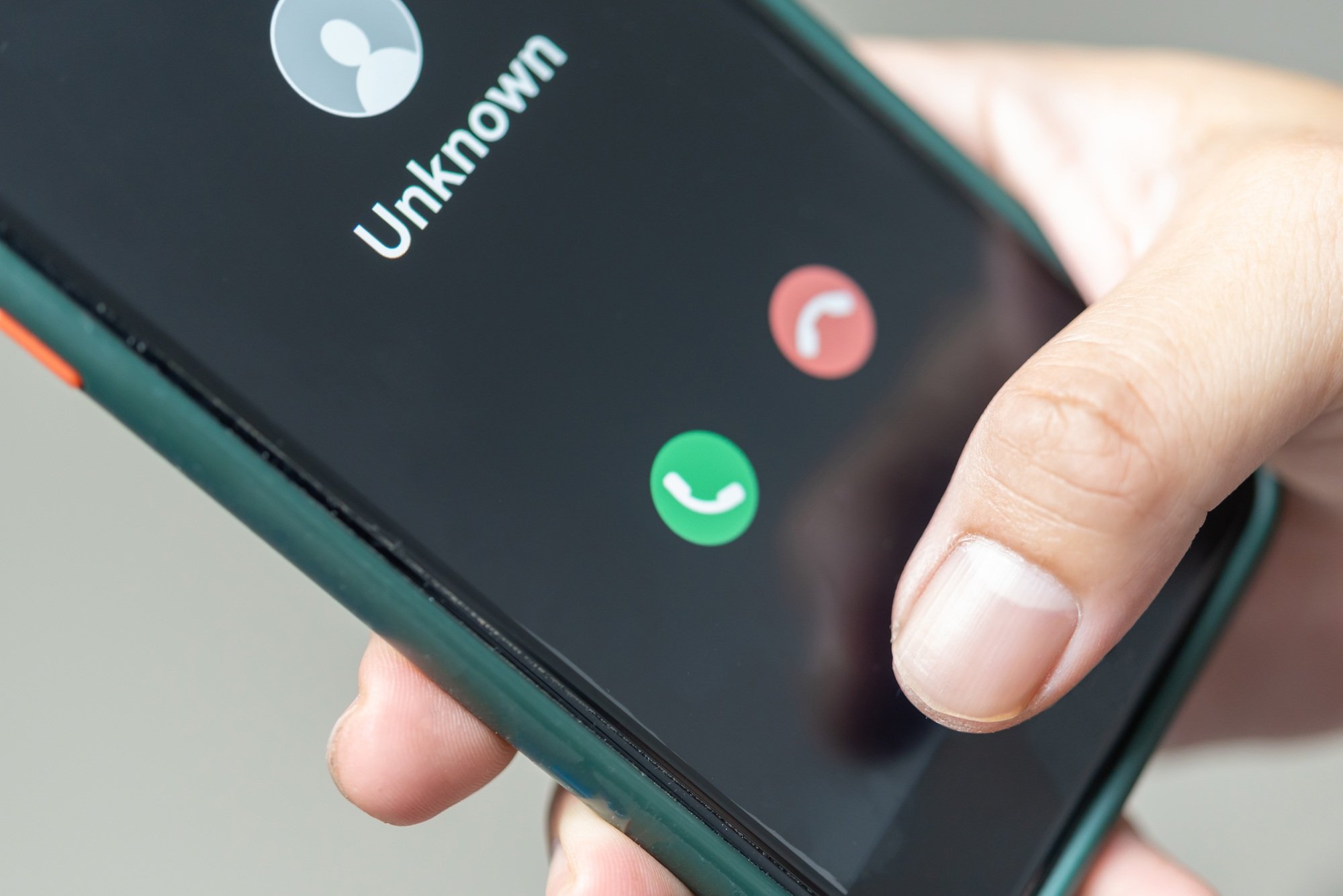 Man holding mobile Phone call from unknown number. Scam, fraud or phishing