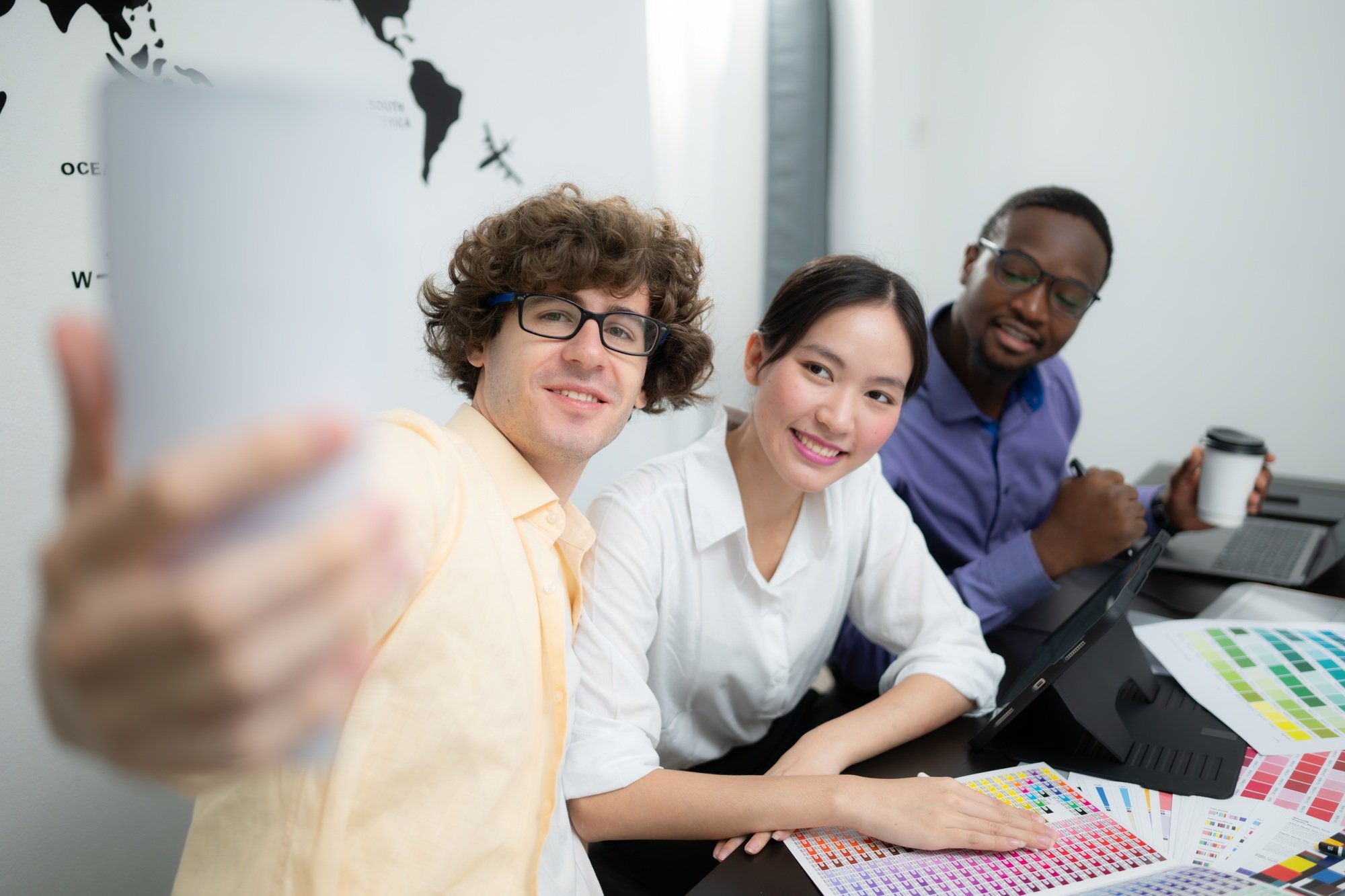 Multiethnic team of architects and designers are meeting to brainstorm design an application