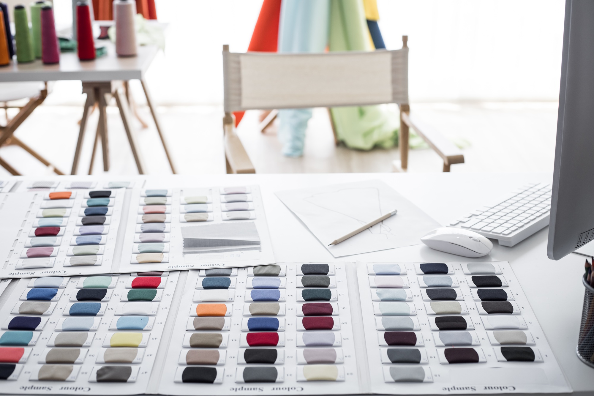 On table of clothing designers of start up business