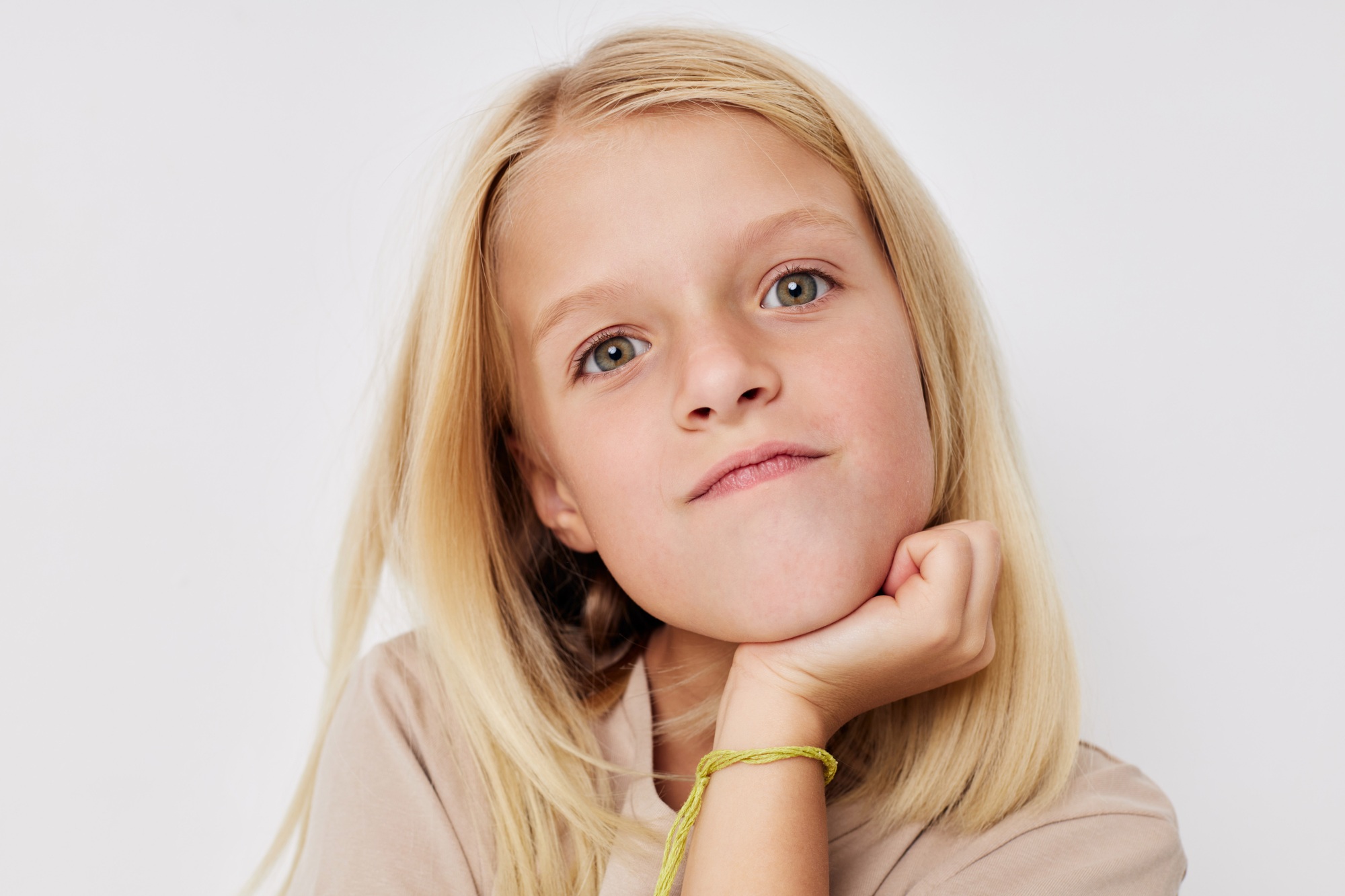Portrait of a smiling little cutie hand gesture fun fashion posing studio