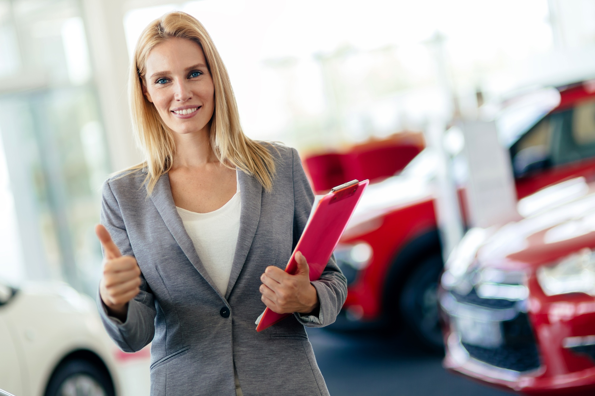 Professional salesperson in car dealership