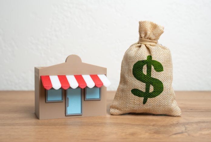 Shop and dollar money bag. Income and profit. Franchise revenue. Open your own business