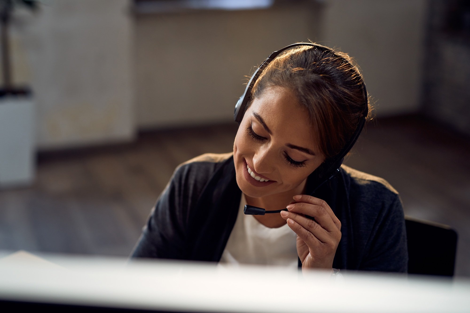 Smiling customer service representative working in the office.