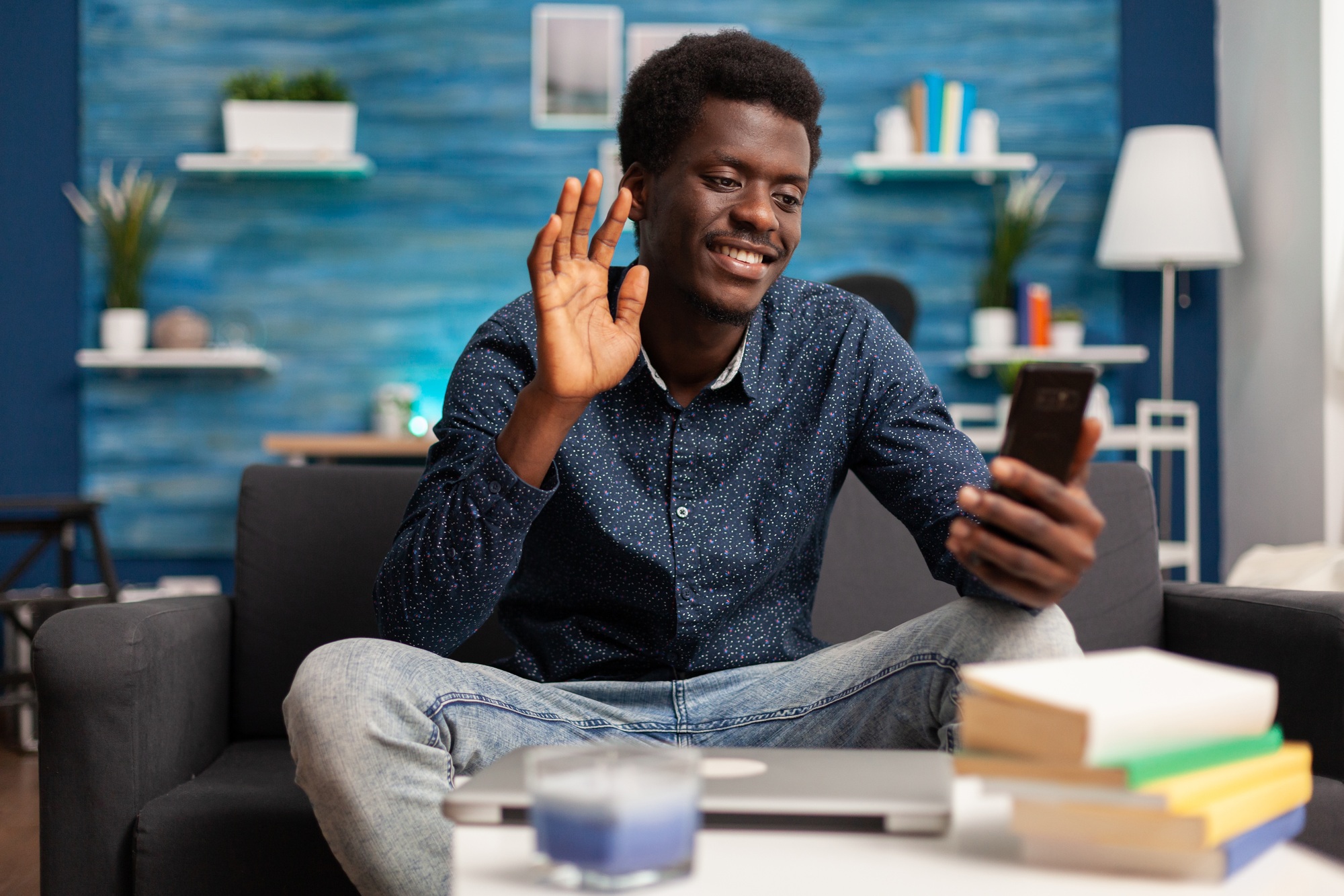 Smiling teenager greeting remote collegue discussing marketing ideas