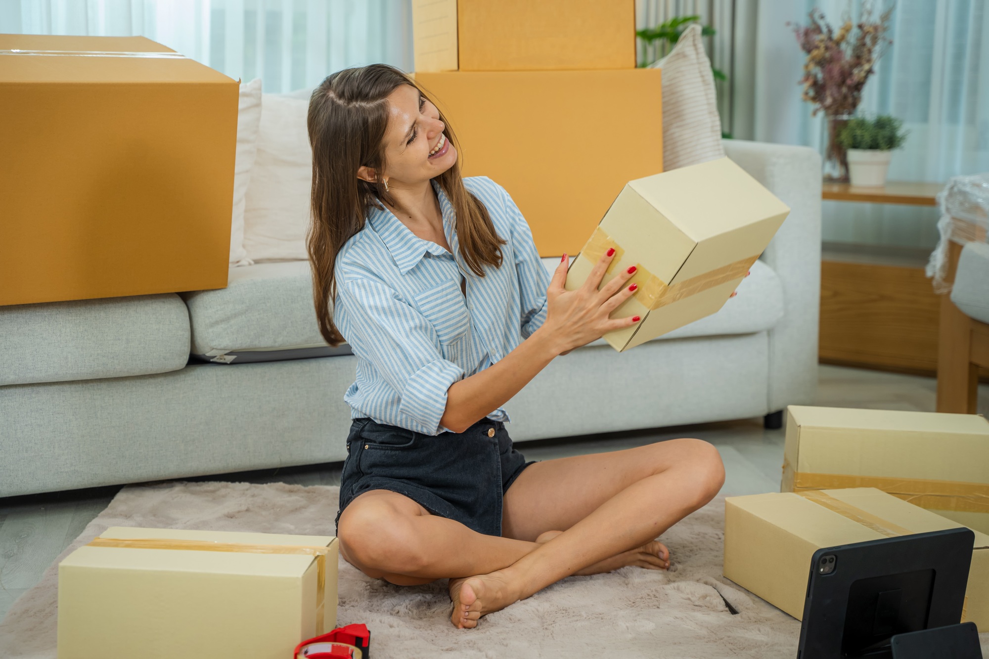 Start up small business concept,Women working at home with packing box of her online store prepare.