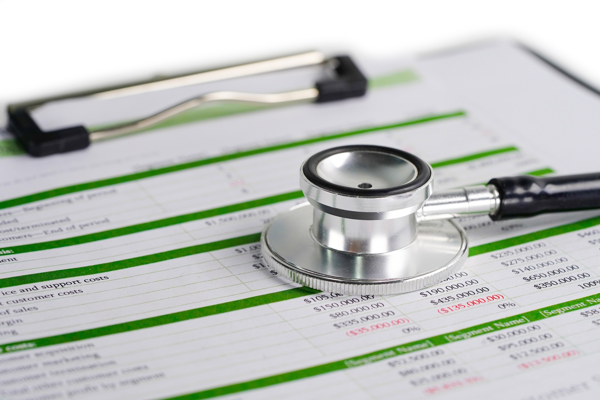 Stethoscope on spreadsheet paper