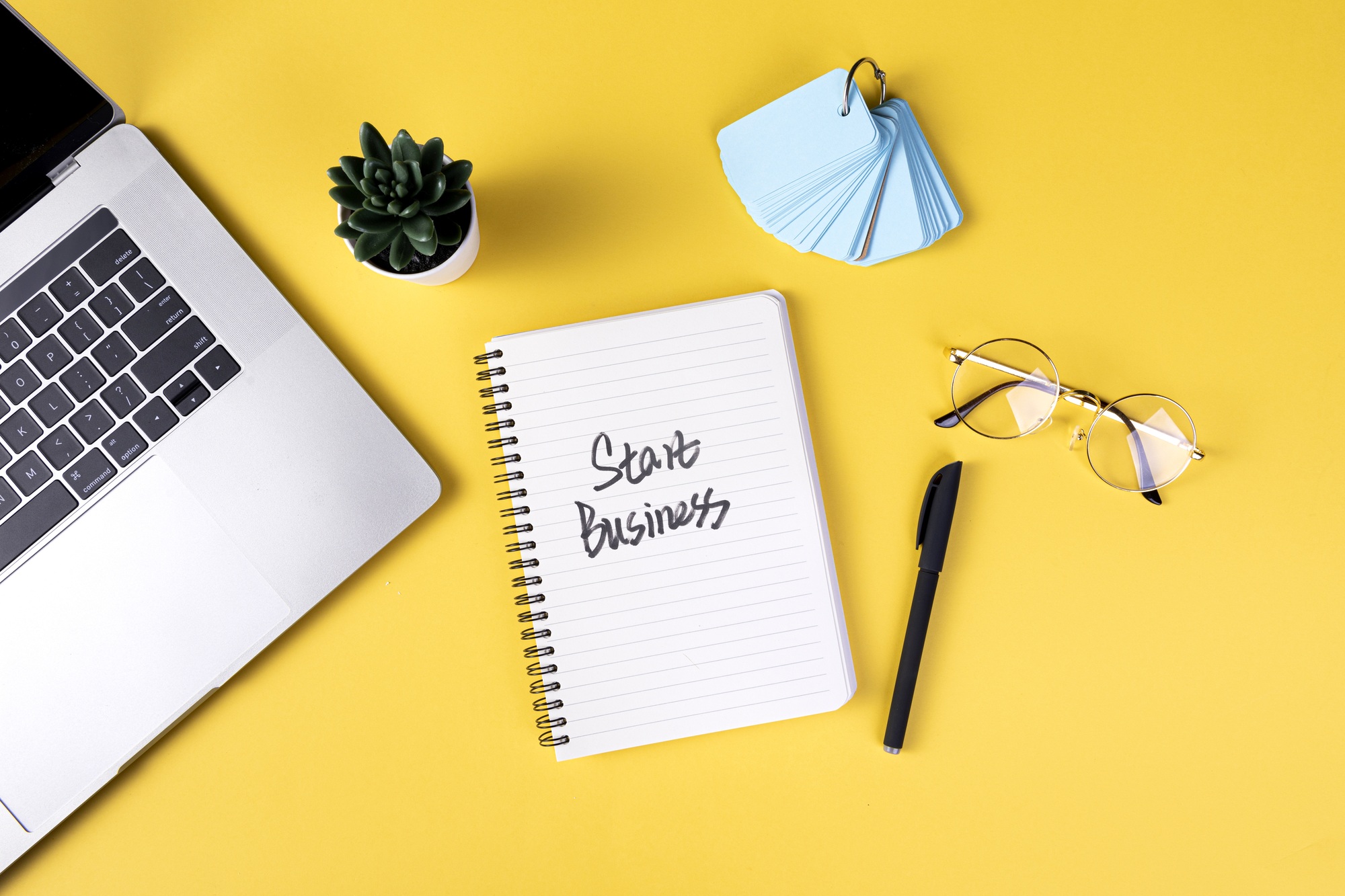 Top view of the working table with different office tools - planning a new business