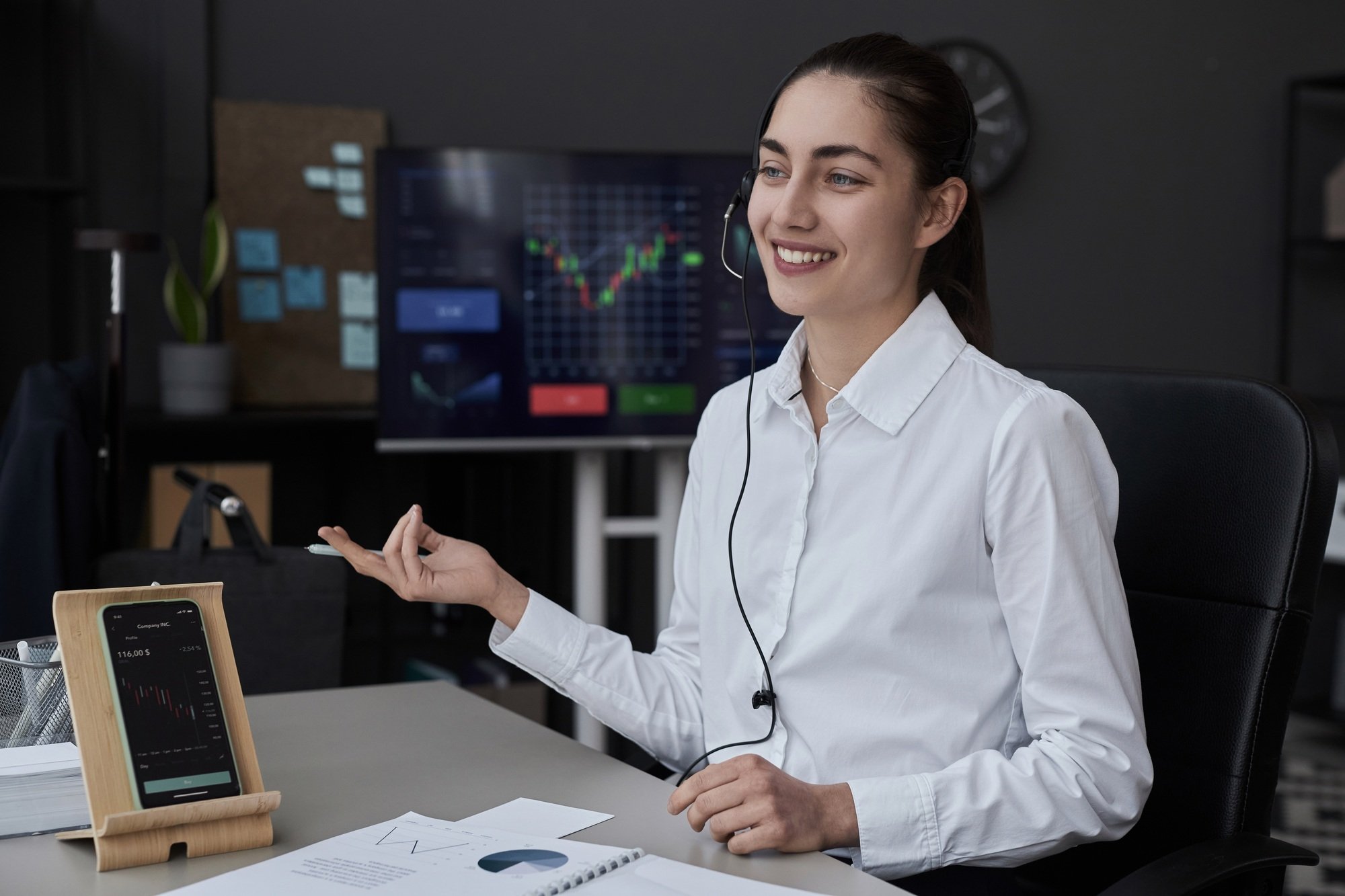 Trader talking to customer in office