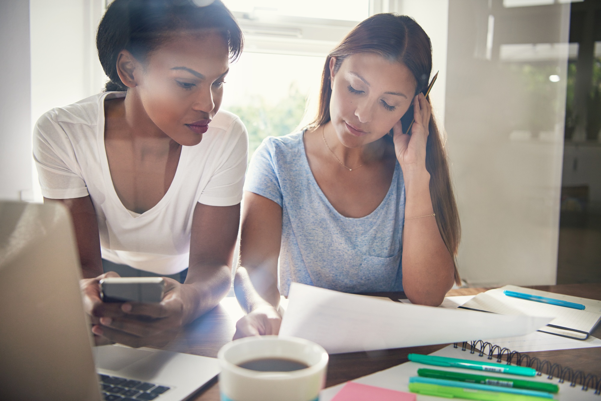 Two business colleagues checking a spreadsheet