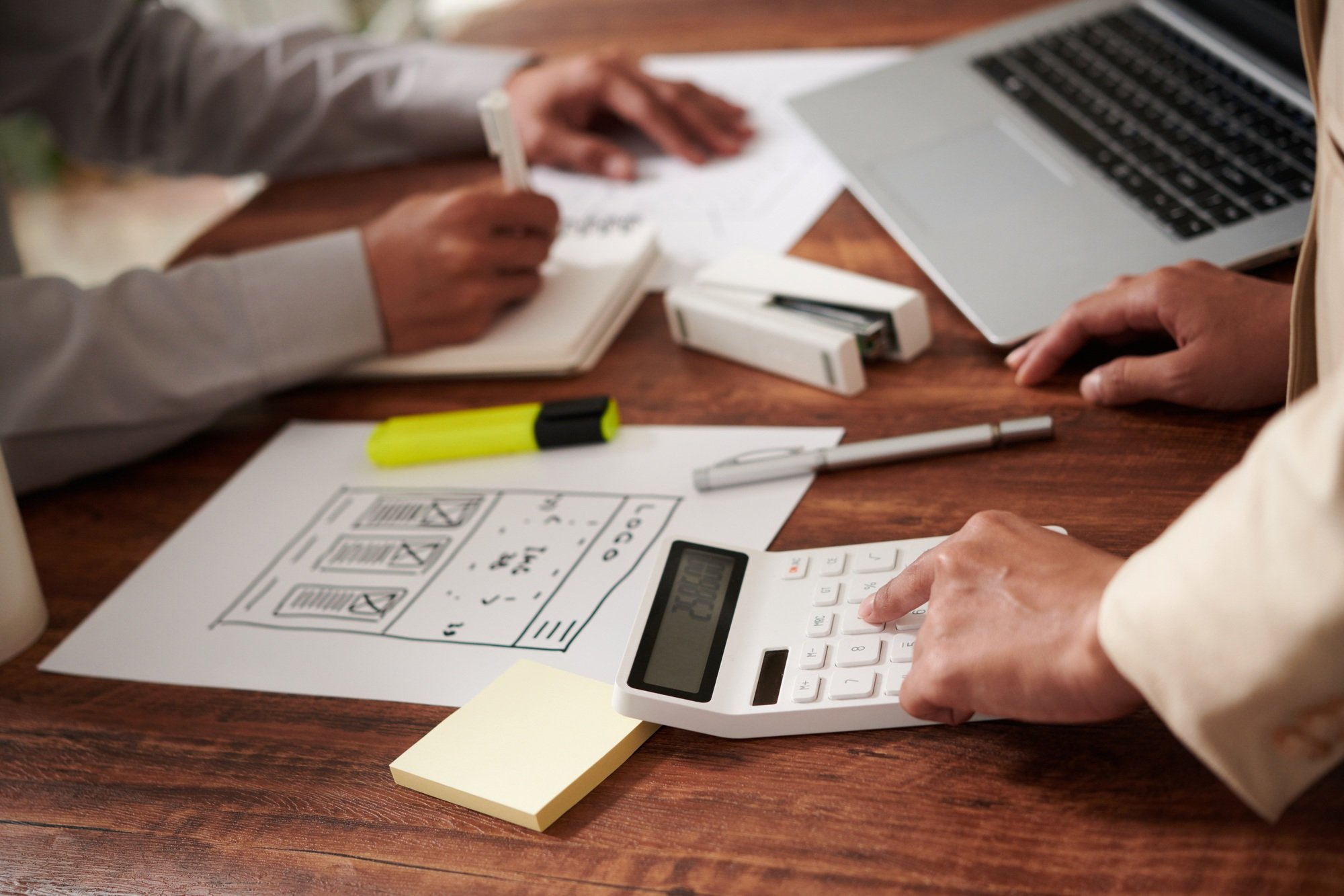 UI Designers Calculating Price of Work