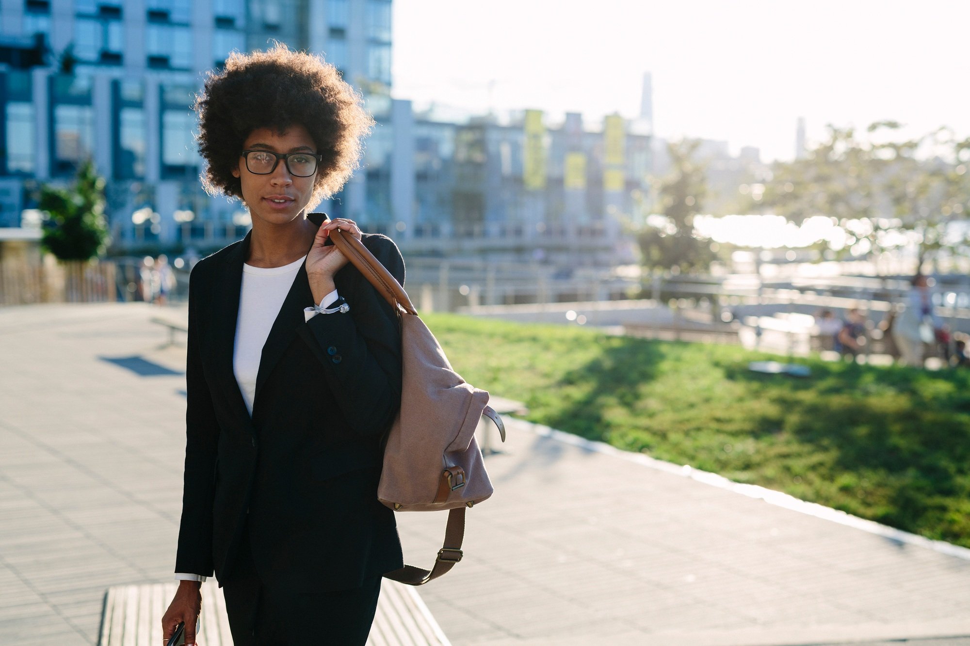 USA, New York City, portrait of businesswoman with bag