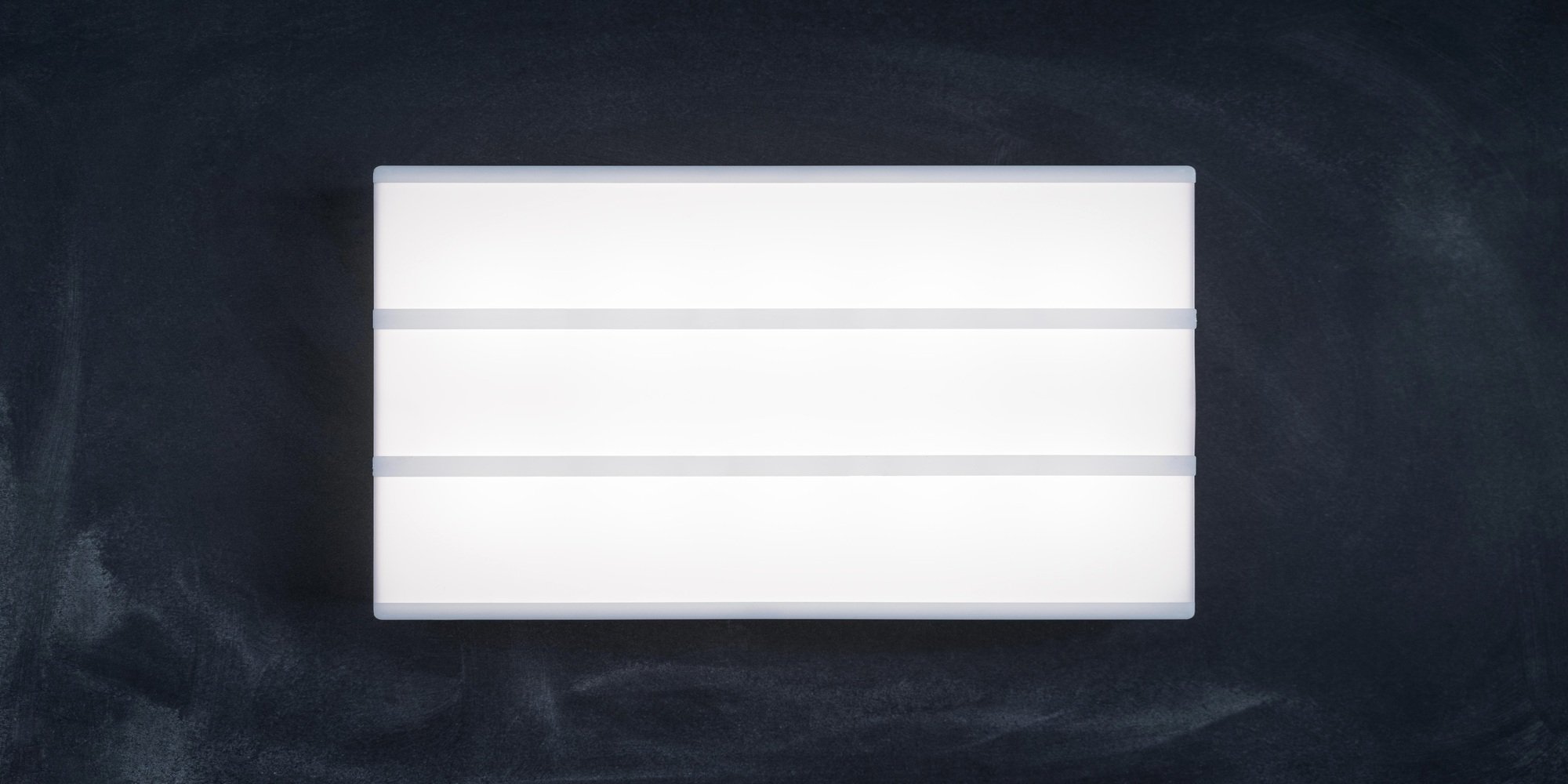 Wide lightbox luminous display without letters on the dark chalk board