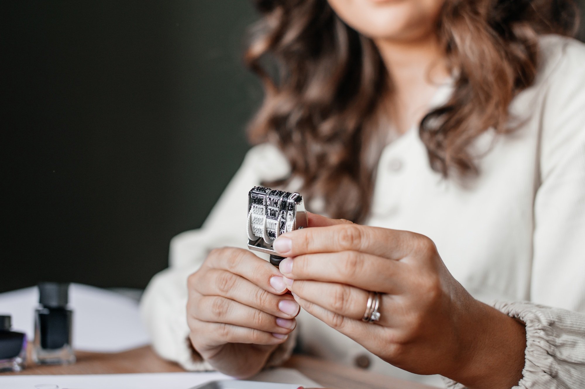 Woman Crafting Handmade Jewelry at Work Table
