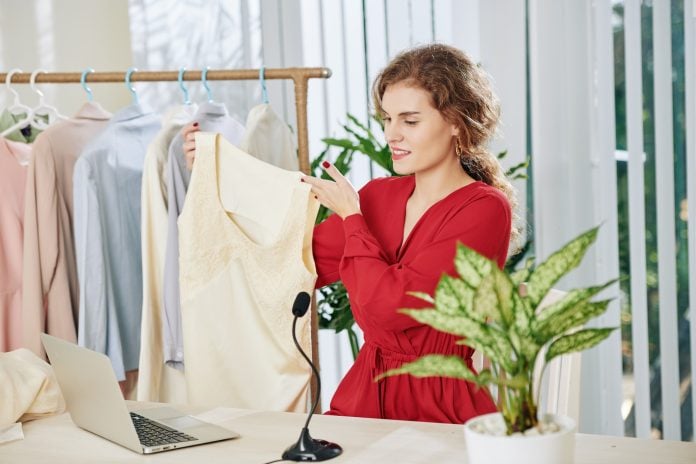 Woman filming spring fashion haul
