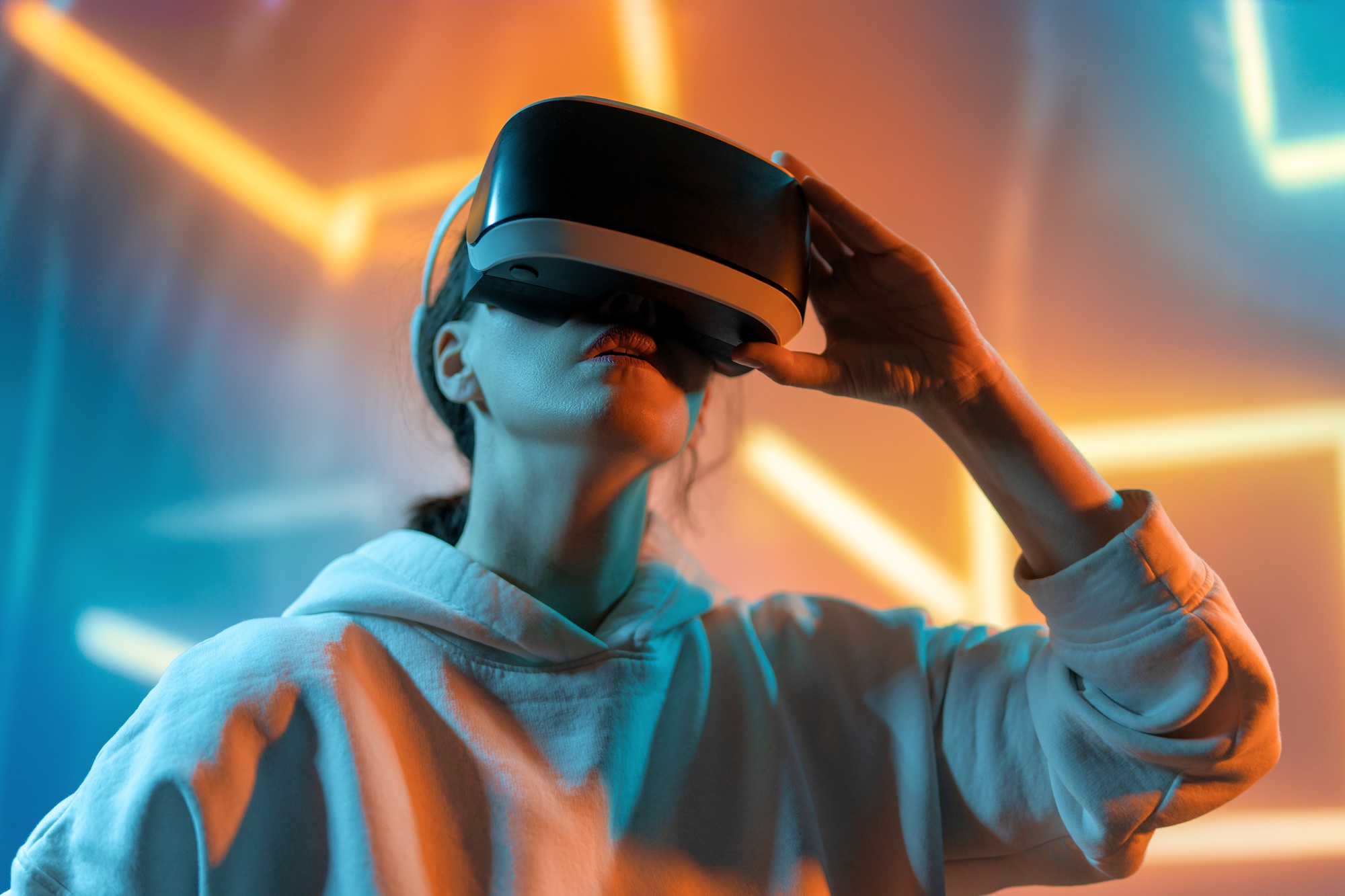 Woman with VR virtual reality goggles