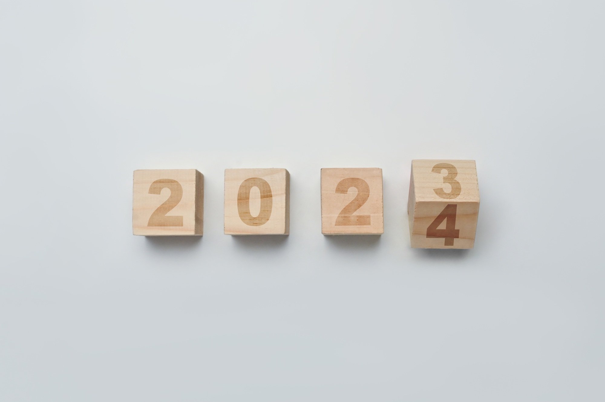 Wood cubes or blocks turning year from 2023 to 2024. Start new year concept