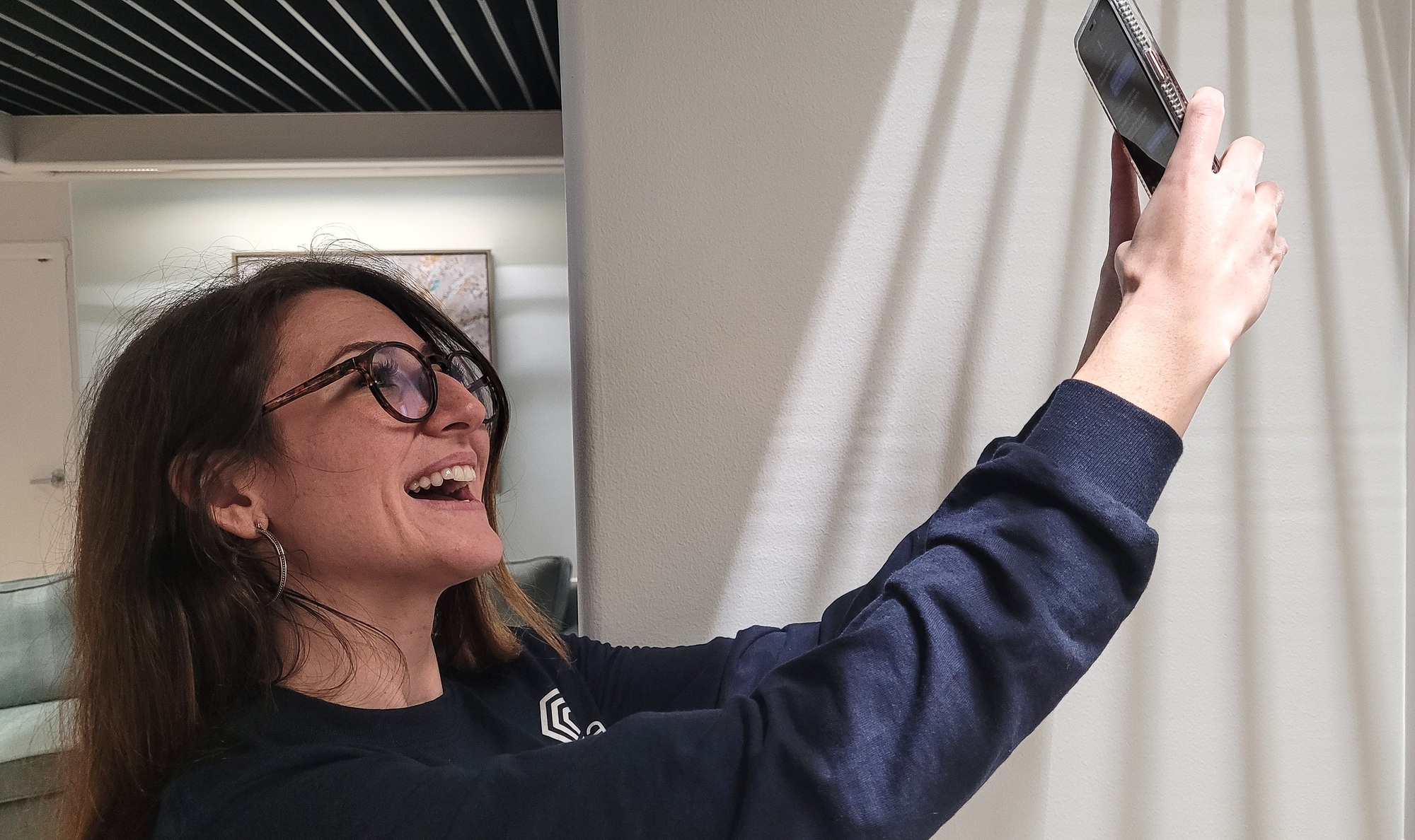 Young business professional millennial woman taking a new profile photo for social media platform.