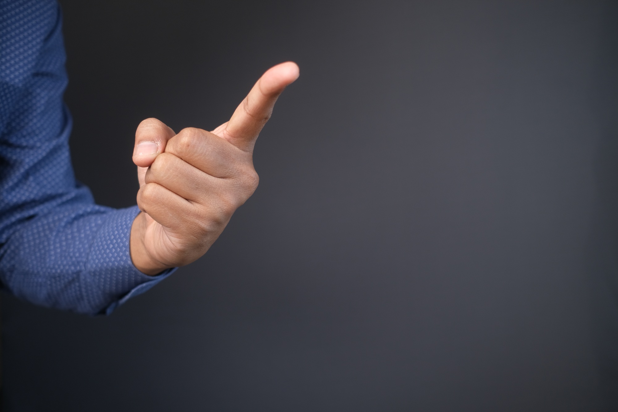 young businessman in suit point finger at camera,
