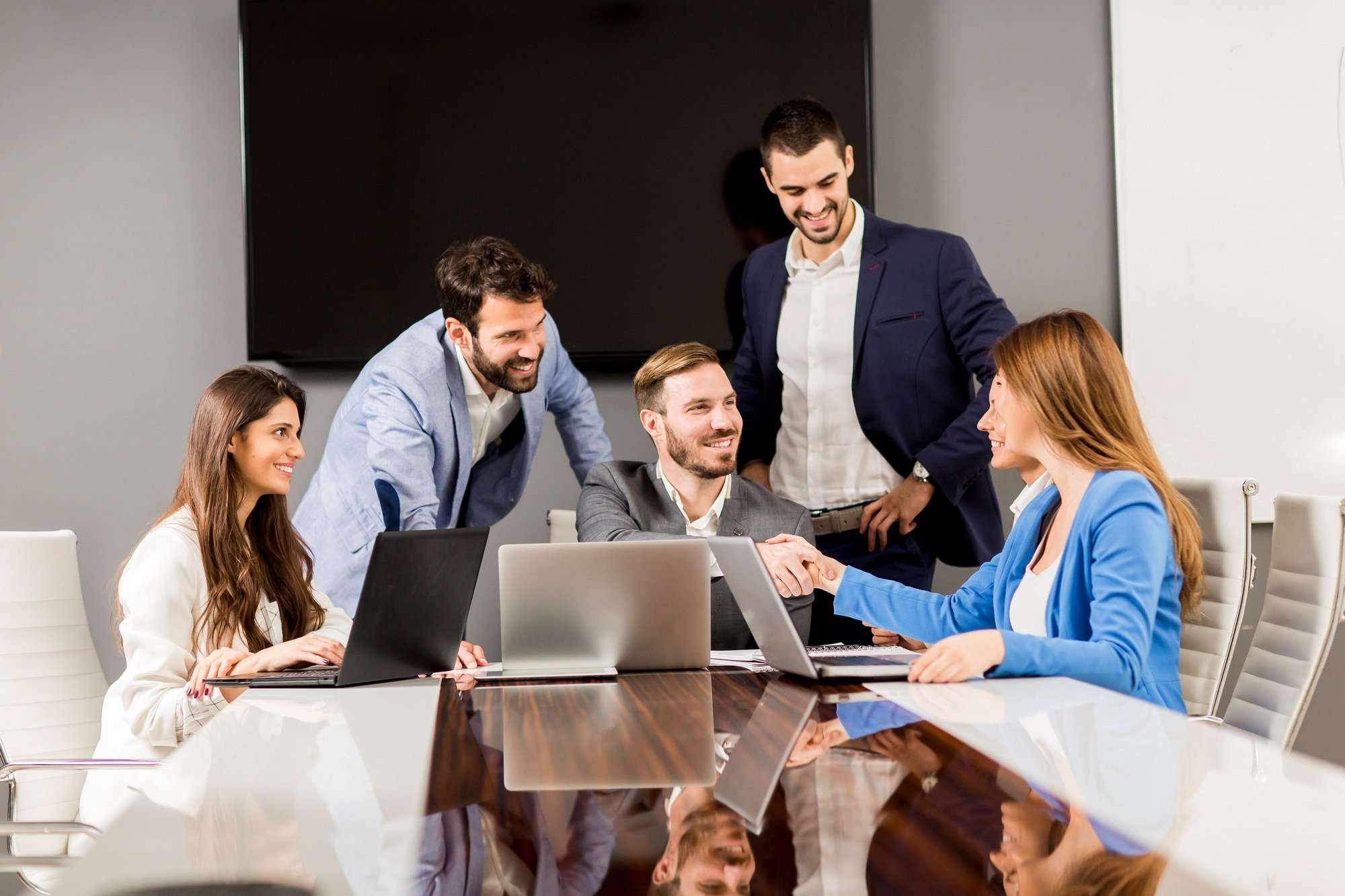 Young successful managers discussing new business project