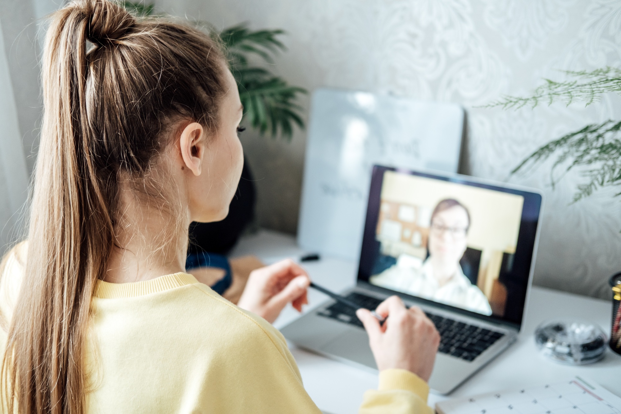 Young woman student applicant having online virtual video call job interview meeting with female hr