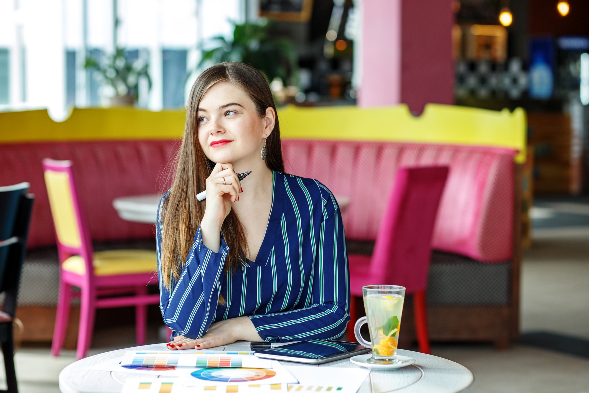 Young woman works remotely. New ideas. Motivation. The concept o