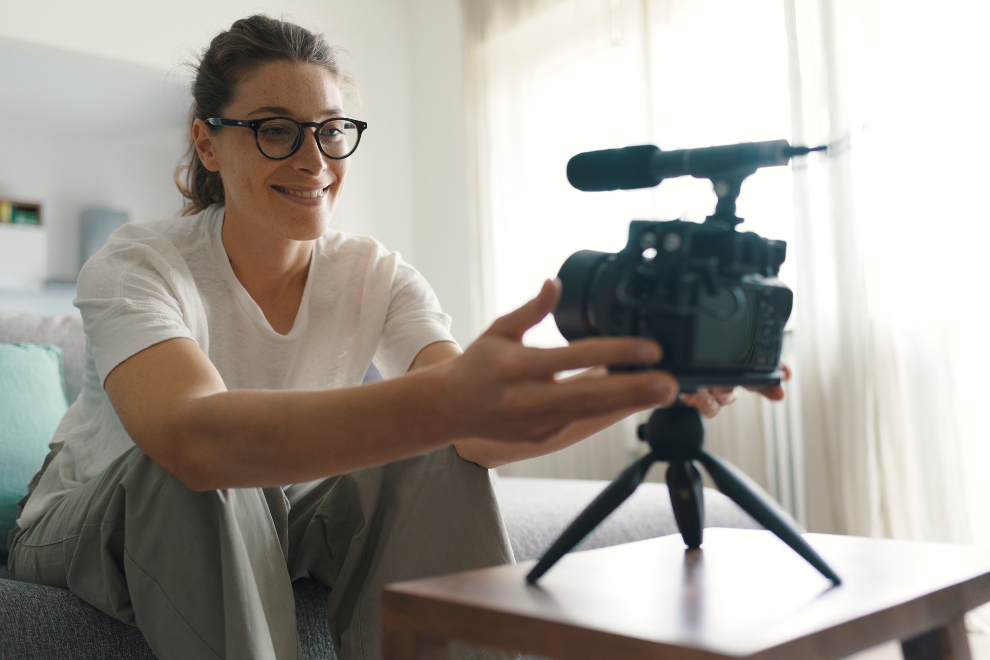 Youtuber recording a video in the living room
